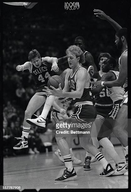 Celtics' Larry Bird jumbles the ball as he takes down a rebound after Danny Ainge missed a jumper in 1st quarter action 2/19. Bird took the ball back...