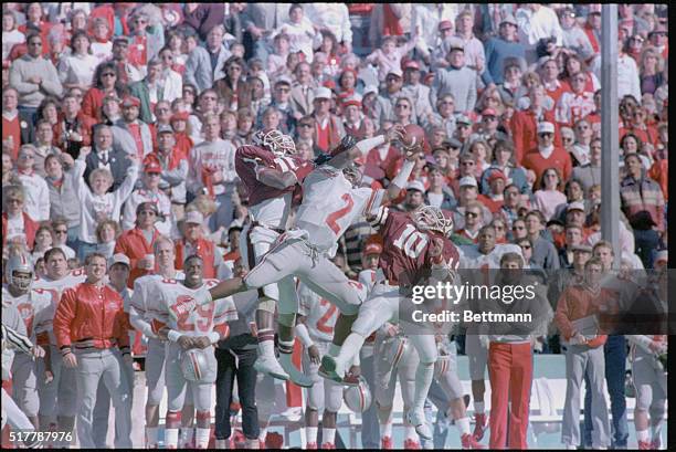 Dallas, Ohio: Ohio's State's Chris Carter leaps high into the air to catch a pass between Texas A&M defenders James Flowers and Kip Corrington in 1st...
