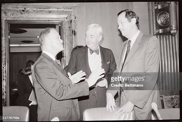 Left to right are Senators Bob Packwood, , Daniel Moynihan, , and Bill Bradley, , as they confer before a Senate Finance Committee meeting. The...