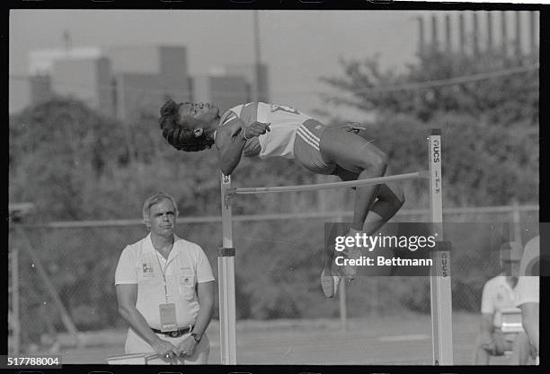 Clearing the bar, Olympic silver medalist Jackie Joyner-Kersee, Long Beach, California, competes in the high portion of the women's seventh event...