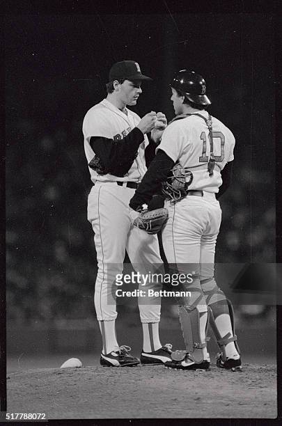 Red Sox pitcher Roger Clemens, , and catcher Rich Gedman confer on the mound in this image, after Clemens gave up four runs in opening game with the...