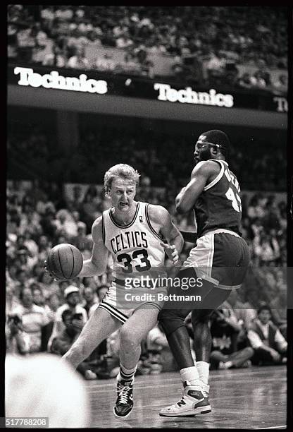 Celtics' Larry Bird drives around Lakers' James Worthy in the 4th quarter of the 3rd game of the NBA Finals at Boston Garden 6/7. Celtics won the...