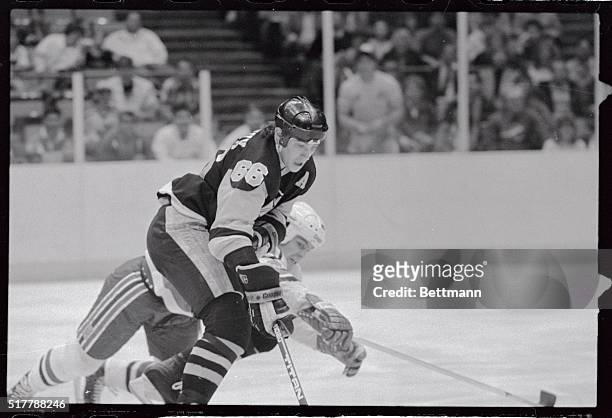 Mario Lemieux of the Pittsburgh Penguins skates in towards the goal as Ken Daneyko of the New Jersey Devils tries to break up the play during first...