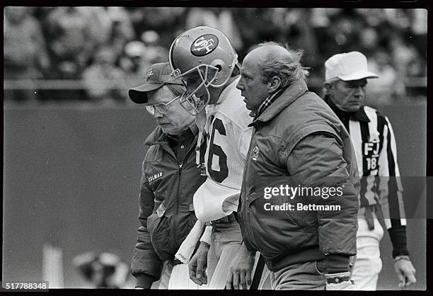 San Francisco quarterback Joe Montana is helped off the field after a second quarter injury in playoff game with the Giants 1/4. It was feared that...