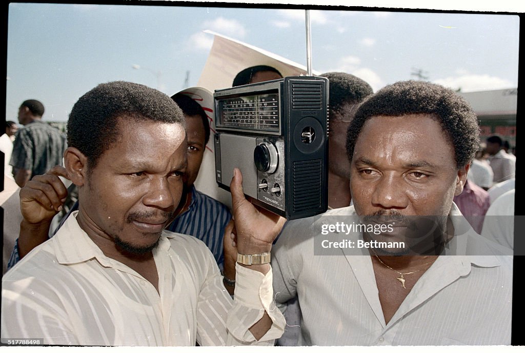 Haitian-Americans listen to a Creole language local radio broadcast ...