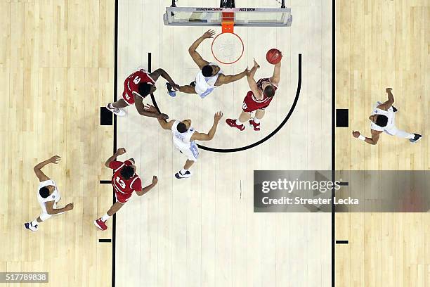 Max Bielfeldt of the Indiana Hoosiers shoots the ball over Kennedy Meeks of the North Carolina Tar Heels during the 2016 NCAA Men's Basketball...