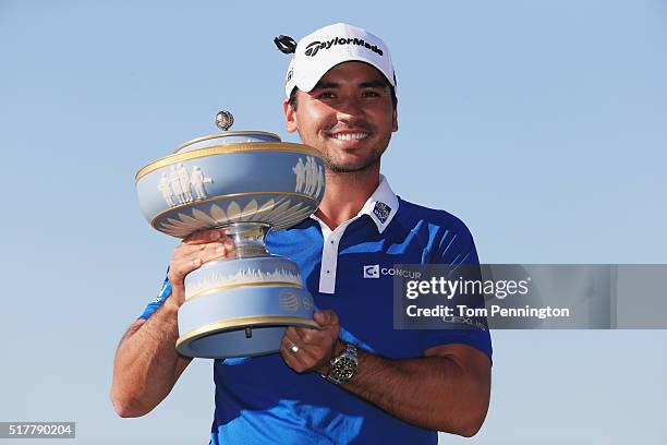 Jason Day of Australia poses with the Walter Hagen Cup after defeating Louis Oosthuizen of South Africa 5&4 in the championship match of the World...