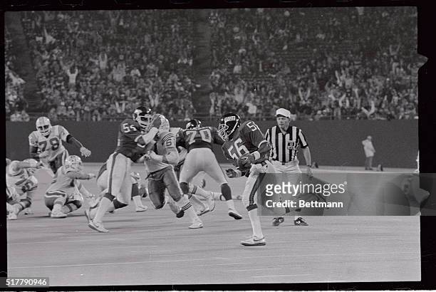 With one minute to go in the game, Lawrence Taylor of the New York Giants intercepts a pass from Patriot's quarterback Steve Gregans pass on the...
