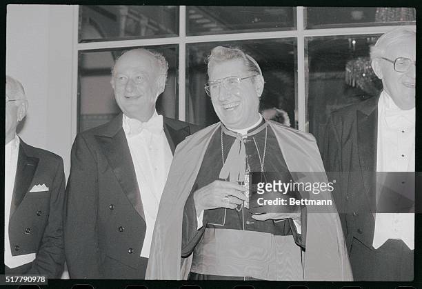 Manhattan, New York, New York: Cardinal John O' Connor and Mayor Edward Koch enjoy a laugh together after meeting at the Waldorf Astoria Hotel for...