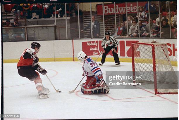New York: New York Rangers' goalie Mike Richter stops a penalty shot that was awarded to the Philadelphia Flyers in the first period. Flyers' Pelle...