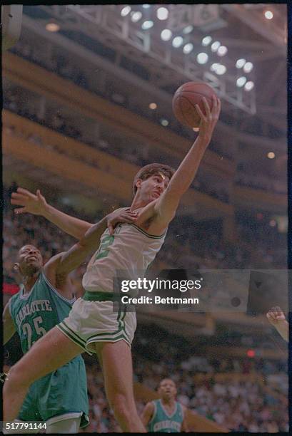 Boston: Boston Celtic Mark Acres stretches for the ball while Earl Cureton tries to push him out, during 2nd quarter action at Boston Garden,...