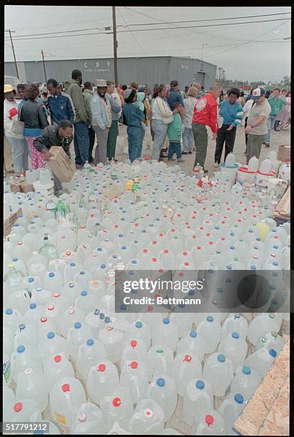 Charleston, S.C.: Residents line up for water and food outside a Salvation Army location after hurricane Hugo swept through the area causing billions...