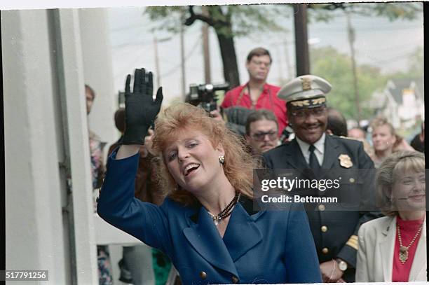 Houston: The Duchess of York waves to admiring crowd as she arrived at the Blackshear Elementary School in Houston. The Duchess is followed by Police...