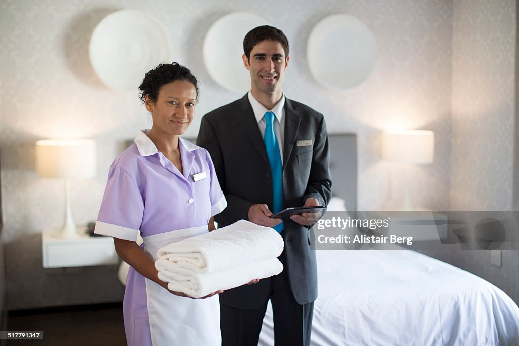 Chambermaid and manager in hotel