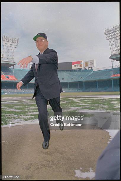 Baseball Commissioner Fay Vincent throwing the baseball from the pitchers' mound.