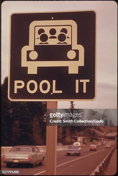 "Pool It" sign north of Vancouver, Washington, was a reminder that the gasoline shortage was not over in March, 1974 and sharing rides was a good...