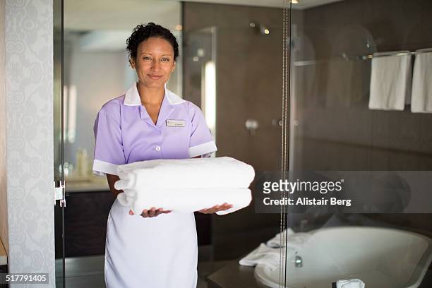 maid in doorway of bathroom - room service stock pictures, royalty-free photos & images