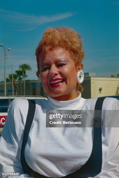 Orlando, Fla.: Tammy Faye Bakker has a broad smile as she meets with the media outside her church. Tammy said her husband Jim Bakker was teaching a...