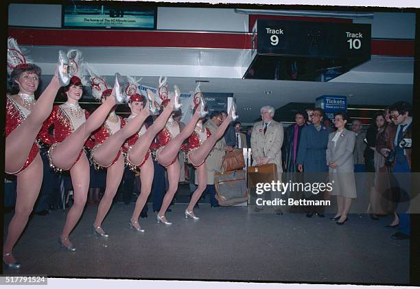 New York: Members of the Democratic National convention Site Selection committee get a big kick out of the welcome they are given by the Radio City...