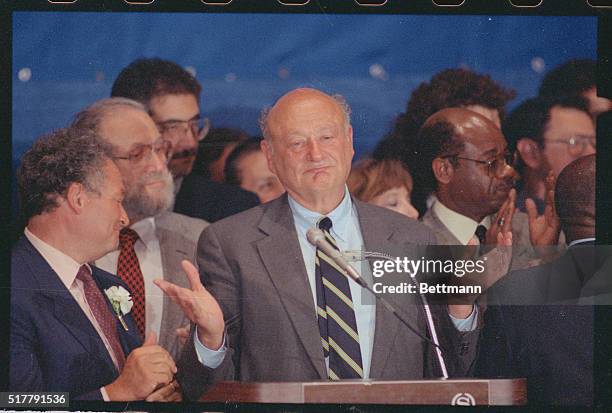 New York: Mayor Ed Koch holds up his hand to quiet the applause of his supporters as he makes his concession speech after losing the mayoral primary...