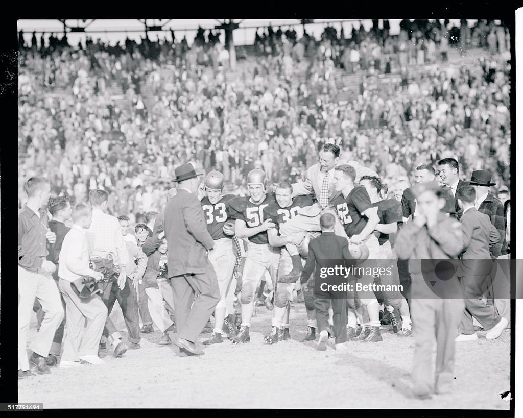 Football Team Carrying Eddie Erdelatz Off the Field