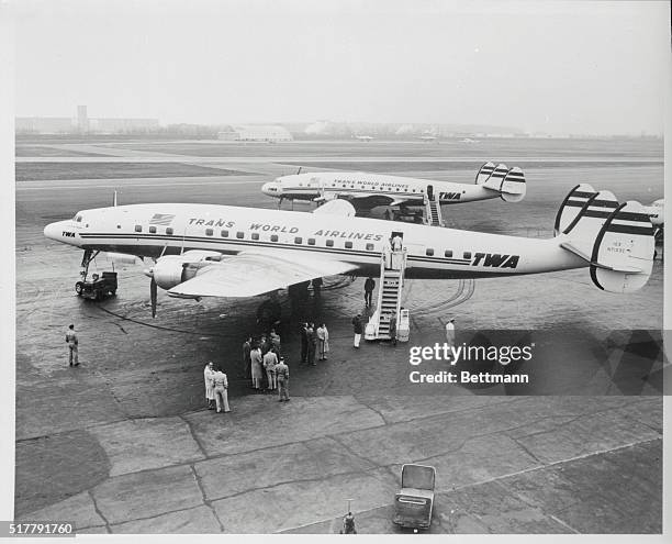 The familiar dolphin-shaped Constellation takes on a new look with the advent of TWA's new Super-G model. The white fuselage with red TWA markings,...