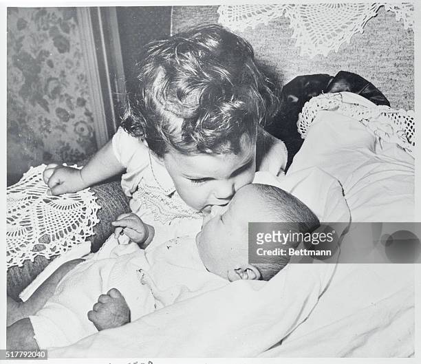 Lucie Desiree Arnaz kisses her famous little brother Desiderio Alberto Arnaz IV. They are the children of television couple Desi Arnaz and Lucille...