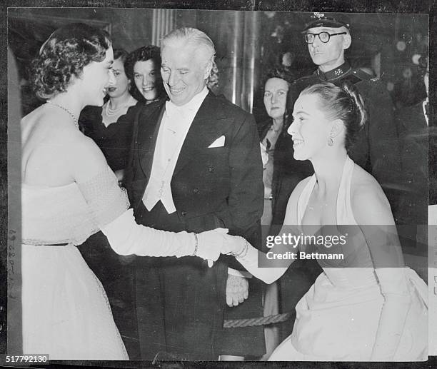 Chaplin Premiere is Gala Event in London. London, England: Princess Margaret shakes hands with a curtseying Claire Bloom, while comedian Charlie...