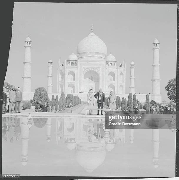 Like many a tourist before them, President Eisenhower, daughter-in-law Barbara, and Indian Prime Minister Jawaharlal Nehru stand before the famed Taj...