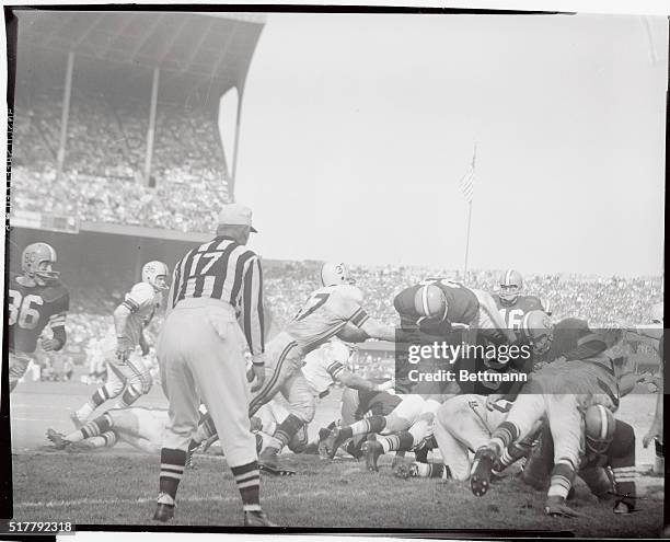 Cleveland Browns' fullback Jim Brown plunges over the Pittsburgh Steeler line to score a touchdown from the one-foot line in the fourth quarter....