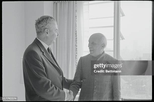 Indian Prime Minister Jawaharlal Nehru has a smile and a handshake for Canadian Prime Minister John Diefenbaker here, September 27th. Diefenbaker...