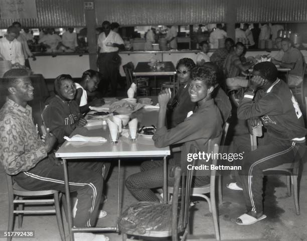 Ray Morton and Wilma Rudolph are shown with others in the International Restaurant at the Olympic Village.