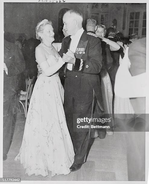 General Omar N. Bradley, chairman of the Joint Chiefs of Staff and Mrs. Fleur Cowles, publisher are shown dancing at the Cornation Ball in London's...