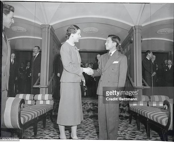 Crown Prince Akihito Greeted by Former Tutor. New York. Crown Prince Akito, 19 year olf heir apparent to the Japanese throne, is shown in a reunion...