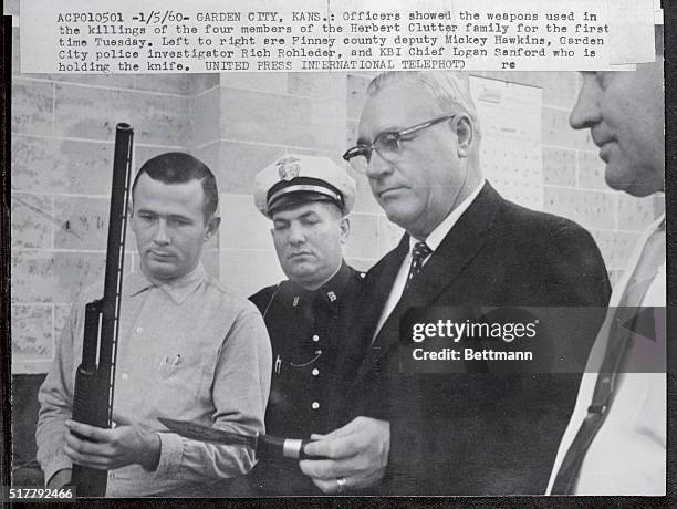 Officers showed the weapons used in the killings of the four members of the Herbert Clutter family for the first time Tuesday. Left to right are:...