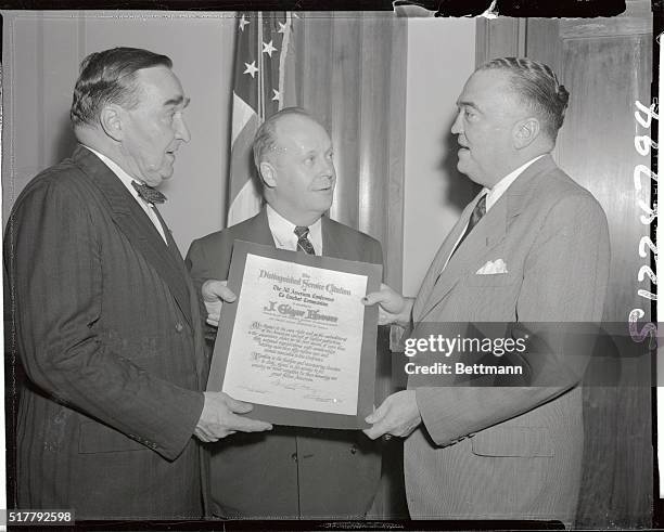 The All-American Conference to Combat Communism today presented J. Edgar Hoover, Director of the Federal Bureau of Investigation, with an award for...