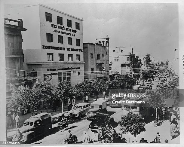 View of Allenby Road in Tel Aviv, reminds the observer of a typical city in any modern country. Here, a tree-lined boulevard reveals bicycles, motor...