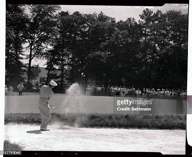 Ben Hogan is shown blasting out of a sand trap on the first hole during today's third round of the National Open Golf championship at Baltusrol. Note...