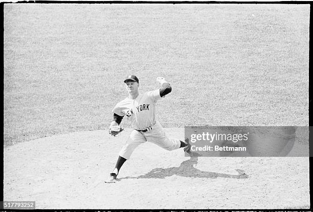 New York pitcher Whitey Ford, shown in action during 8th inning, pitched the Yankees to a 9-0 victory over the Detroit Tigers. It was Ford's 11th win.