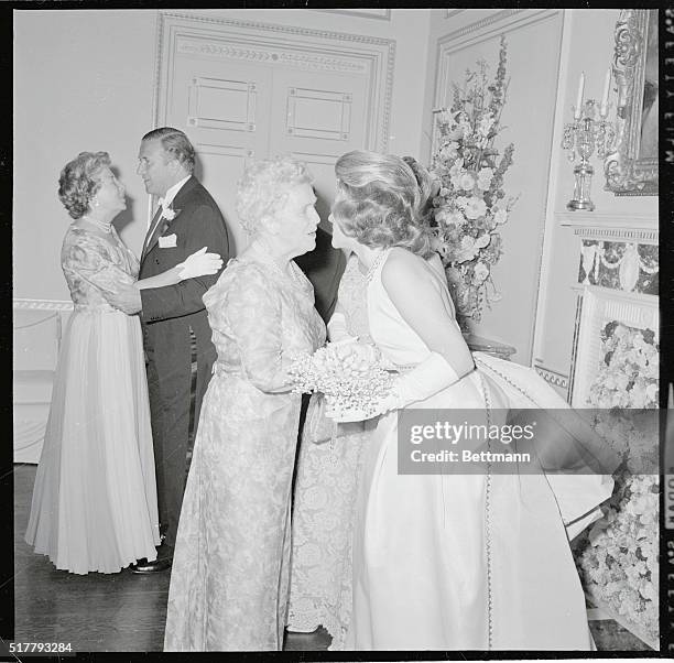 Debutante Anne Ford, 18 is congratulated by her grandmother, Mrs. James F. McDonnell, Sr., of New York, at debut ball 6/19 at the Fords' home. Her...