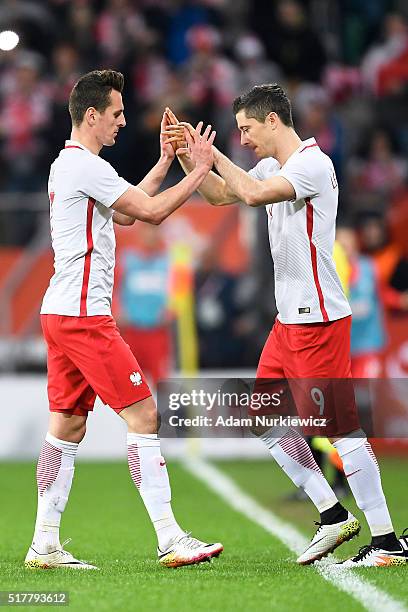 Robert Lewandowski replaces Arkadiusz Milik both of Poland during the international friendly soccer match between Poland and Finland at the Municipal...