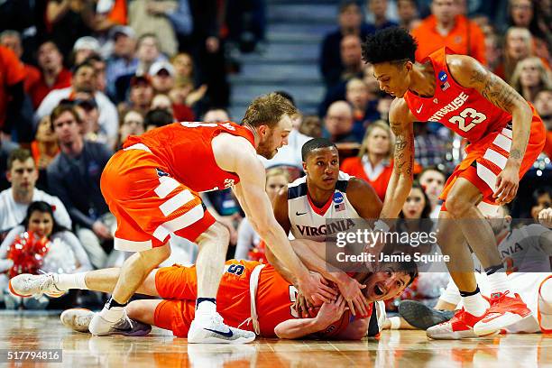 Tyler Lydon of the Syracuse Orange and Devon Hall of the Virginia Cavaliers vie for a looseball in the second half during the 2016 NCAA Men's...