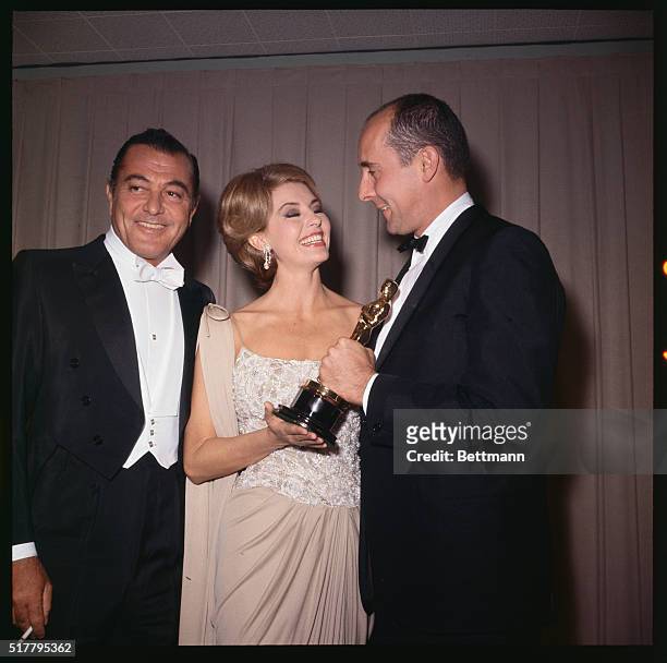 Tony Martin, Cyd Charisse and Henry Mancini are shown with a trophy.
