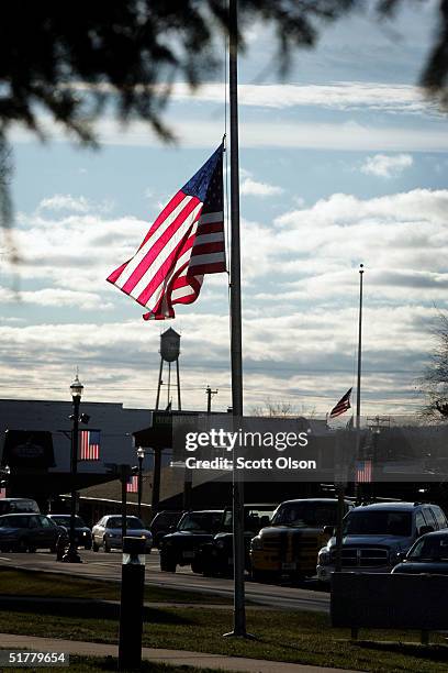 Flag flies at half-mast to honor fallen Wisconsin soldiers in front of the Sawyer County courthouse and elsewhere throughout town November 23, 2004...