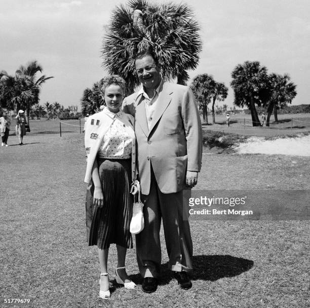 American restauranteur Toots Shor and his wife on the golf course at the Seminole Golf Club, Palm Beach, Florida, early 1950s.