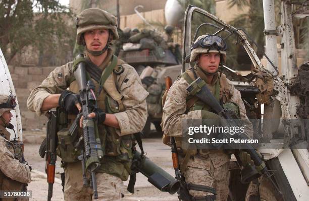 Stepping back into the battlefield, U.S. Marines of the Light Armored Reconnaissance company of 1st Battalion 3rd Marines, clear houses at the site...