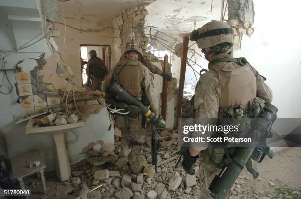 Stepping back into the battlefield, U.S. Marines of the Light Armored Reconnaissance company of 1st Battalion 3rd Marines, clear houses at the site...