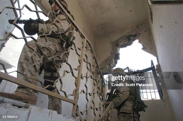 Stepping back into the battlefield, U.S. Marines of the Light Armored Reconnaissance company of 1st Battalion 3rd Marines, clear houses at the site...