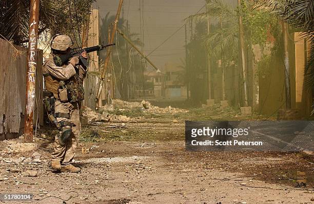 Stepping back into the battlefield, U.S. Marines of the Light Armored Reconnaissance company of 1st Battalion 3rd Marines, clear houses at the site...