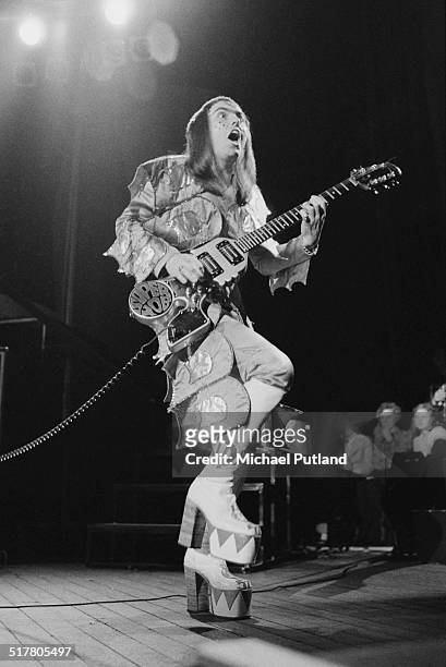 Guitarist Dave Hill performing with English glam rock group Slade at Hammersmith Odeon, during their 'Crazee Nite Tour', May 1974. He is playing a...